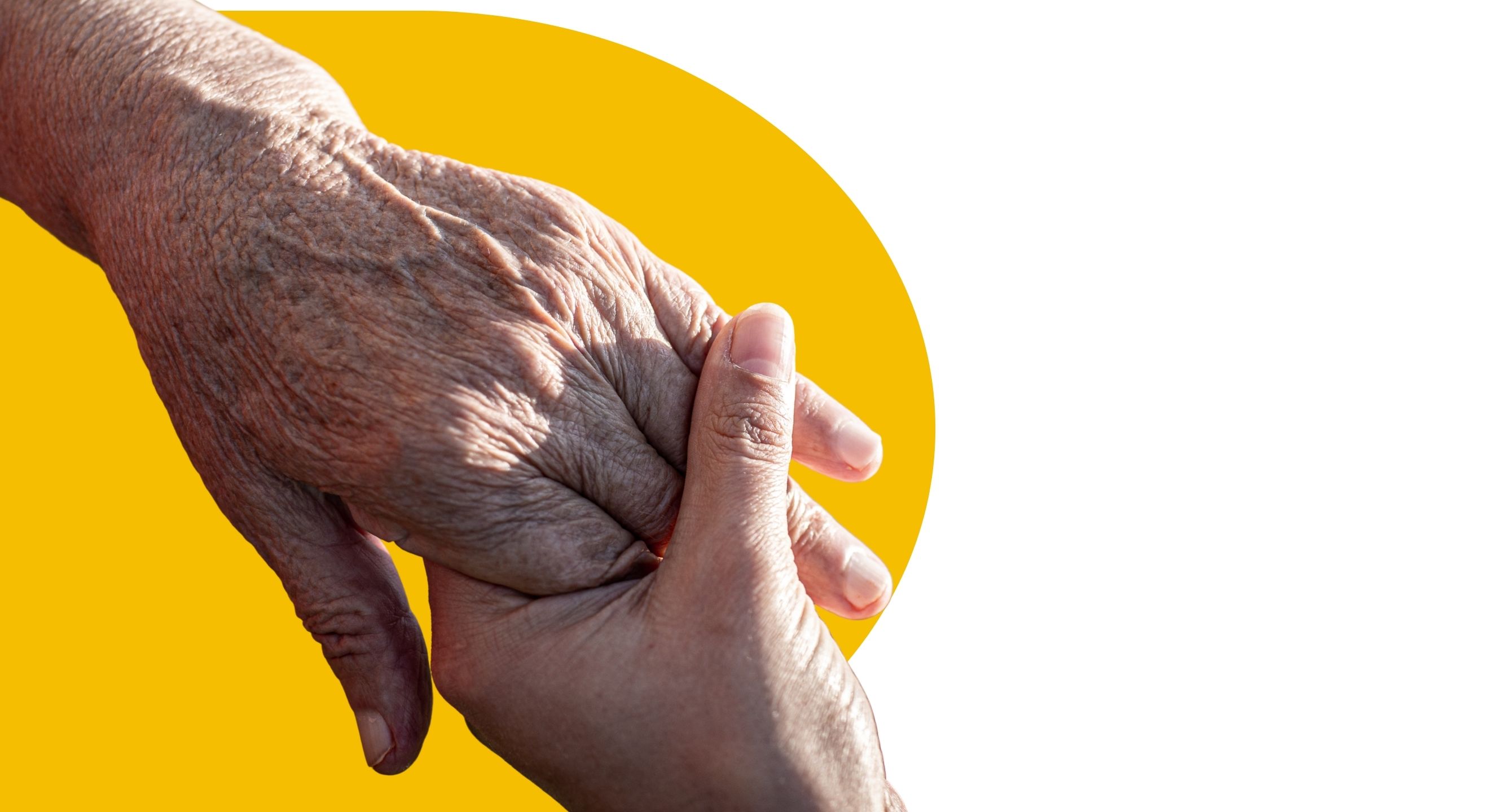 close up of outstretched hands holding in front of yellow and white background