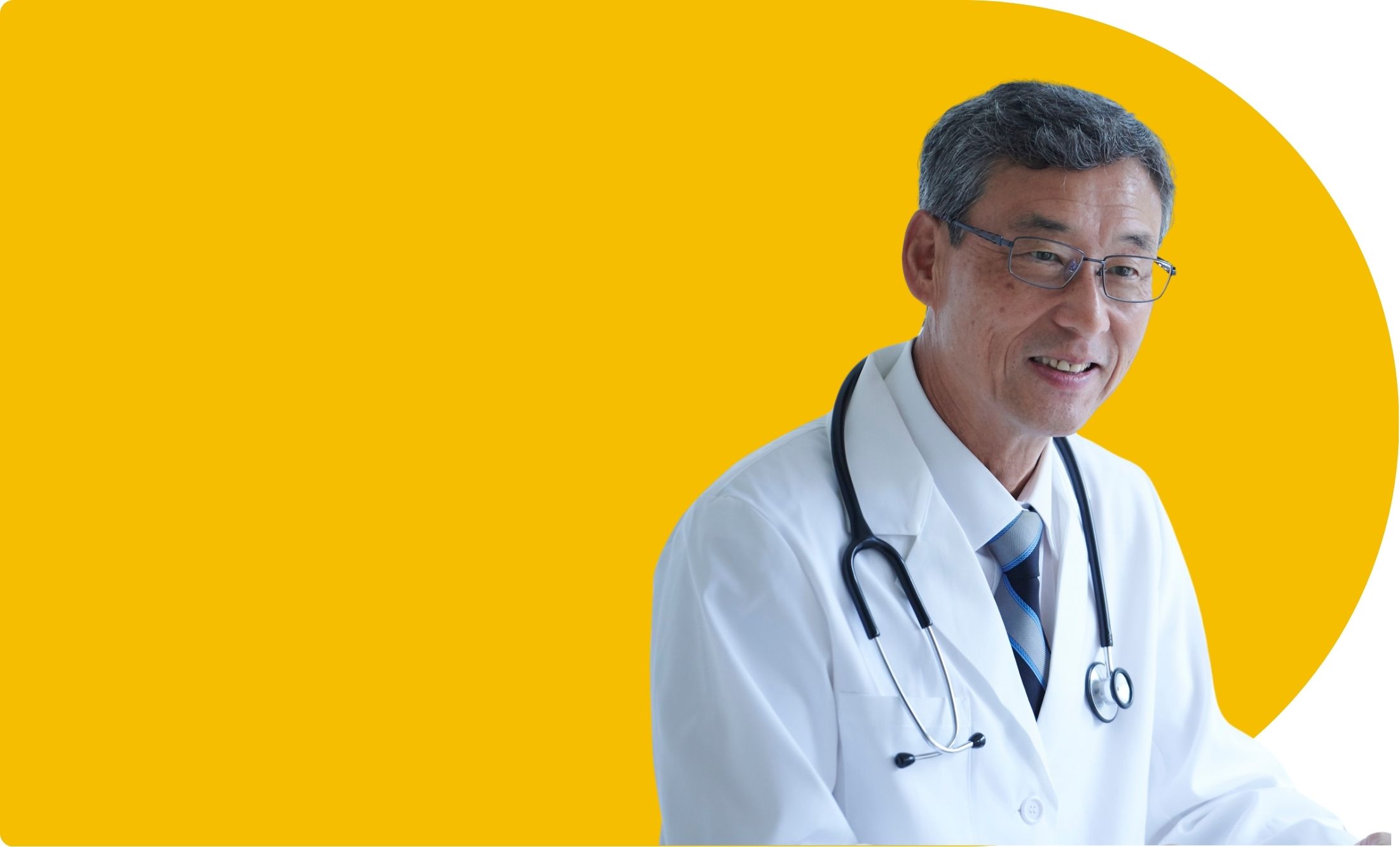 Doctor in white coat smiling at a patient