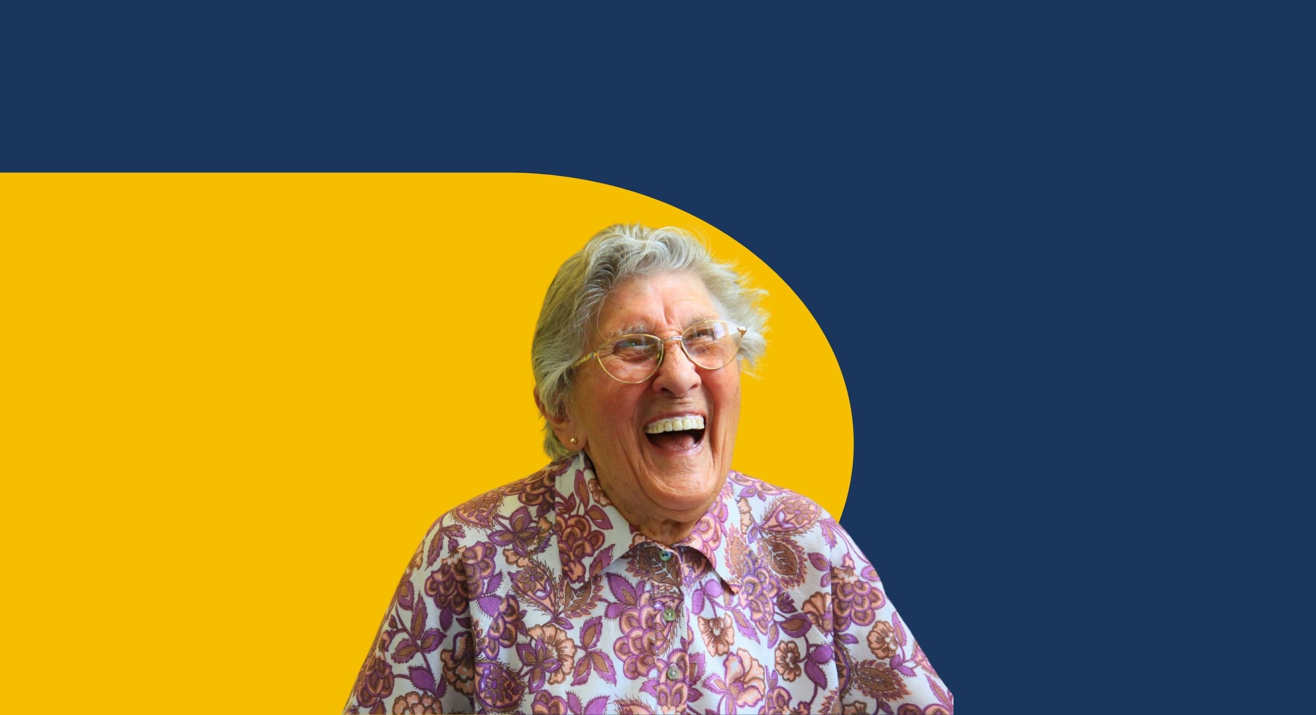 person joyfully smiling in front of yellow and blue background