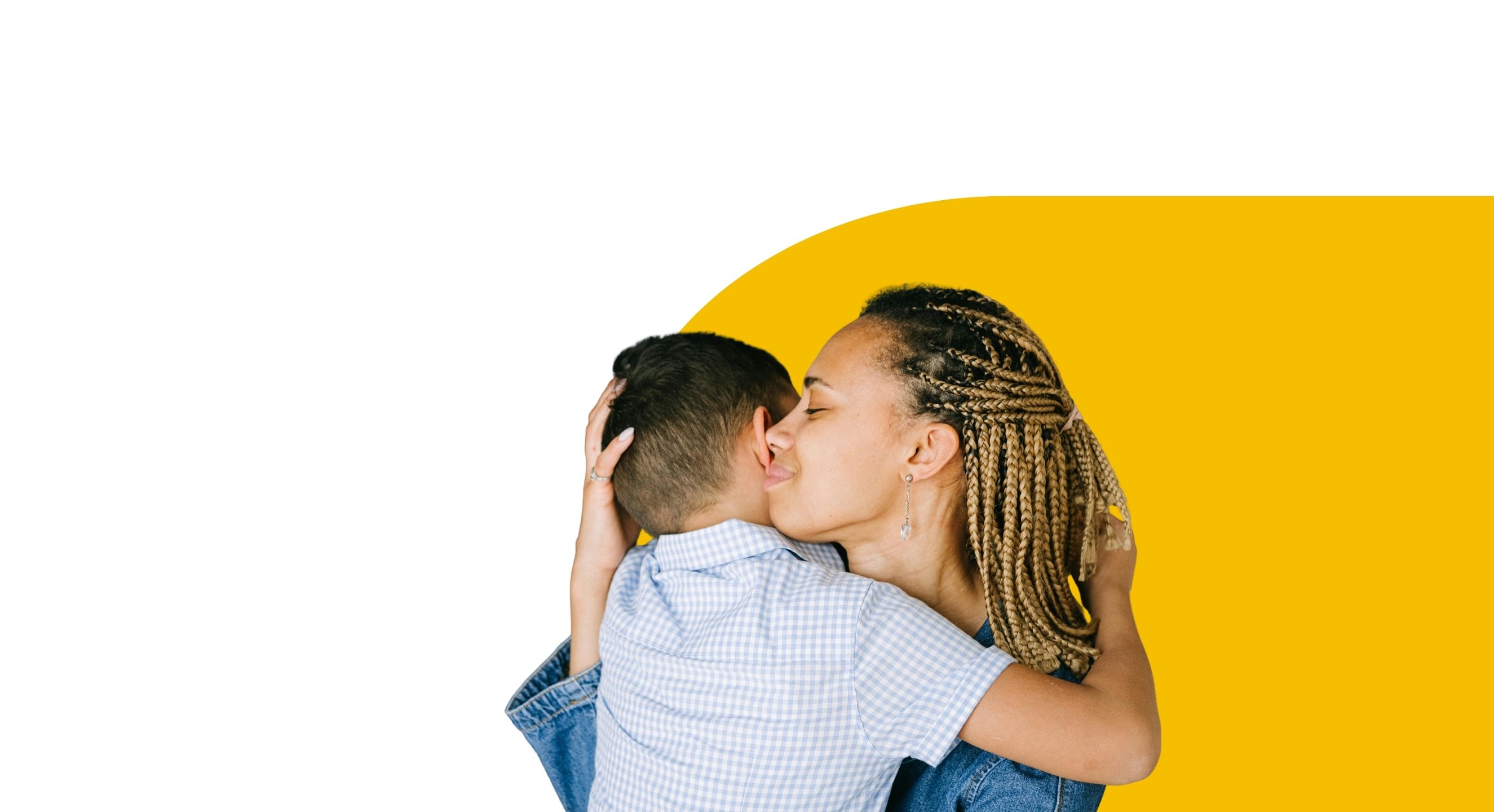 mother holding child in loving embrace in front of yellow and white background