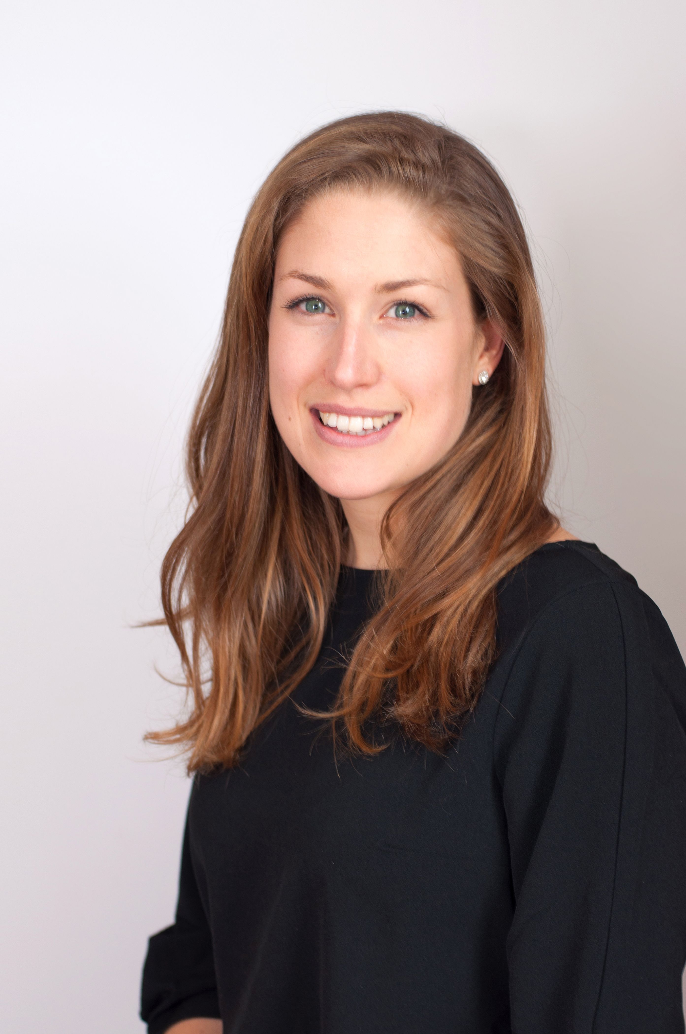 a woman in a black top, the CEO of Sight Research UK, wearing a black shirt and smiling at the camera