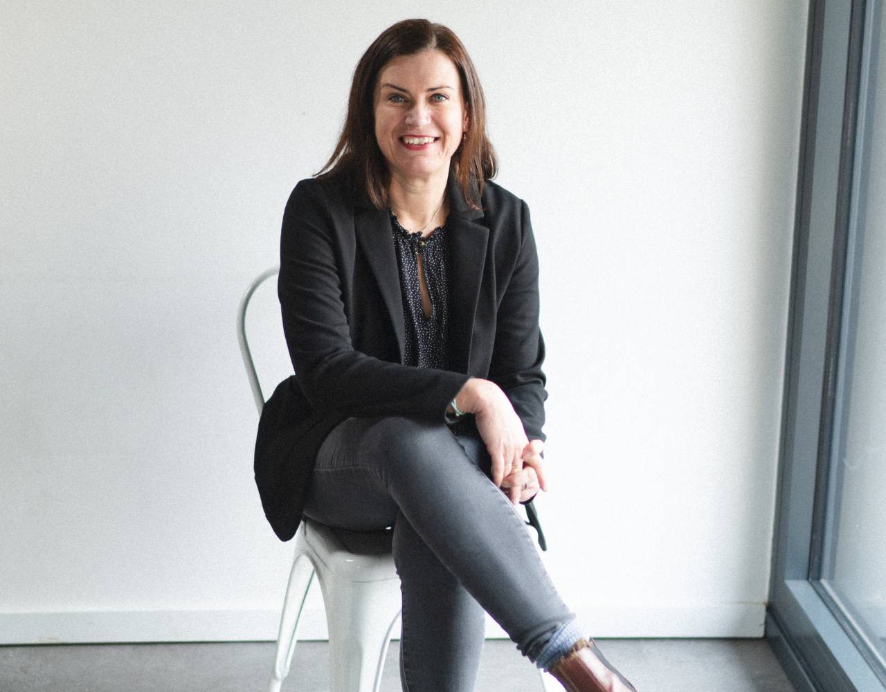 Headshot of CEO Lucy Culkin, smiling directly at camera